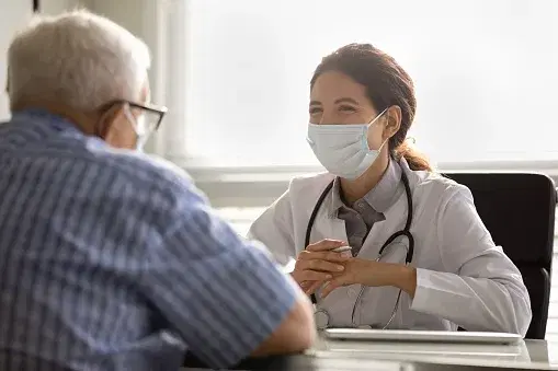 A doctor consulting with a senior resident